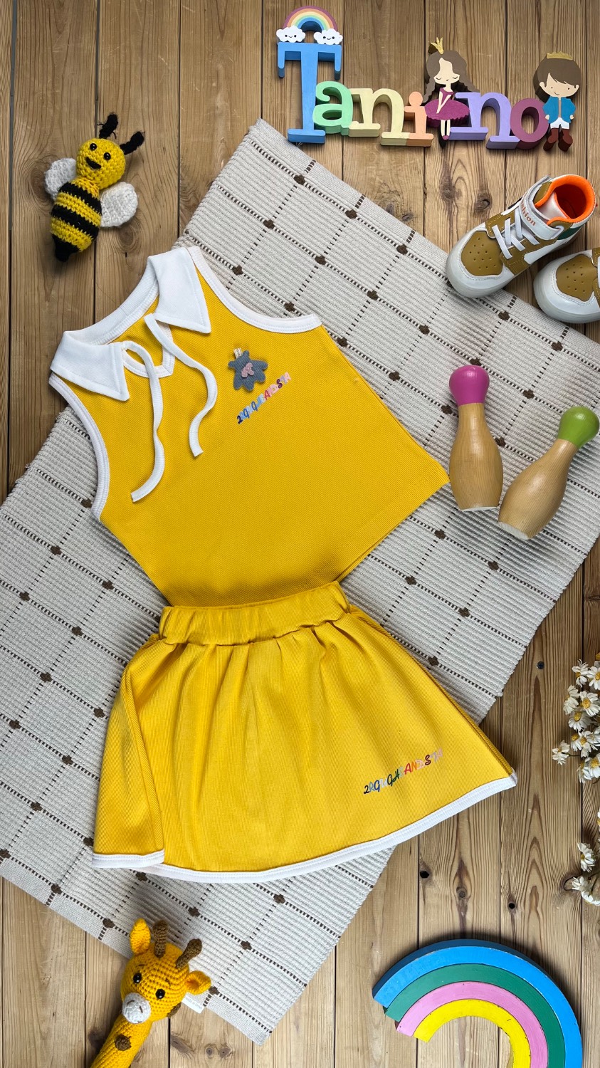 IMG_20260530_185243 کد ۹۶۱ سایز ۳۰ تا ۳۵ تاپ یقه بندی دخترانه با دامن کمر غلفتی طرح نوشته رنگی پارچه کش پنبه و کش اسپان با کیفیت عالی - Image 1